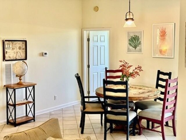 705 Augusta Cir, Saint Augustine, FL 32086 - dining area with light tile patterned floors and baseboards