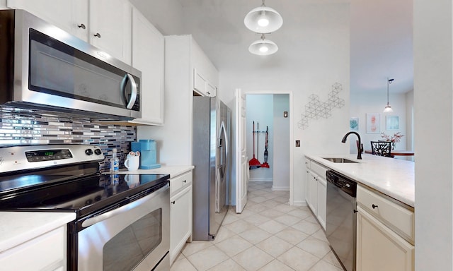 705 Augusta Cir, Saint Augustine, FL 32086 - kitchen featuring appliances with stainless steel finishes, a sink, decorative backsplash, and light countertops