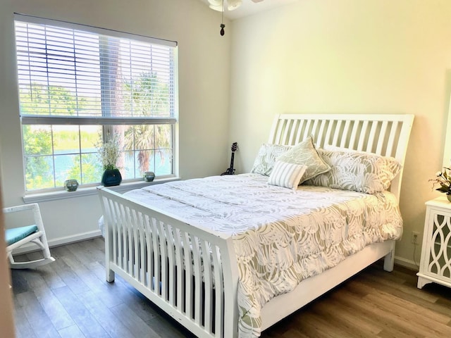 705 Augusta Cir, Saint Augustine, FL 32086 - bedroom featuring multiple windows, wood finished floors, and baseboards