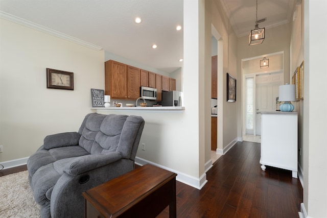 interior space with dark hardwood / wood-style flooring and crown molding