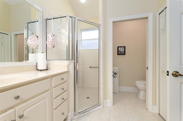 bathroom with vanity, tile patterned flooring, toilet, a textured ceiling, and a shower with shower door