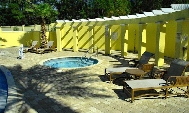 view of pool with a patio area and a community hot tub