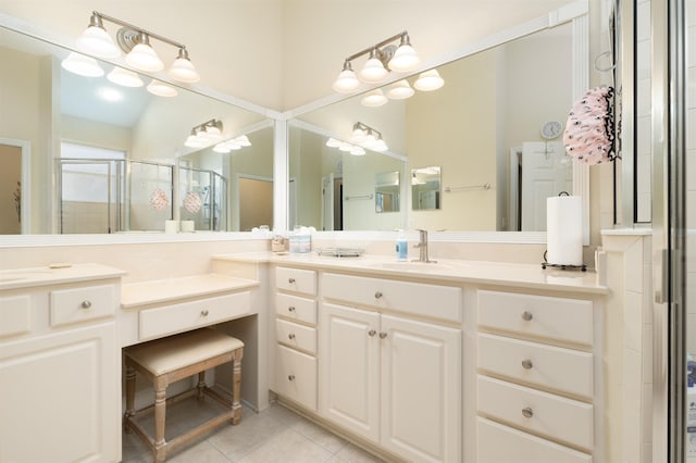 bathroom with vanity, tile patterned floors, and walk in shower