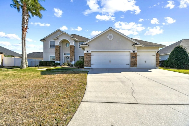 view of front of home with a front lawn and a garage