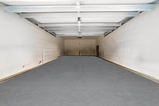 117 Laurel Wood Way Unit 105, Saint Augustine, FL 32086 - garage with a garage door opener and concrete block wall