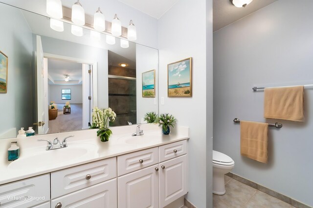 117 Laurel Wood Way Unit 105, Saint Augustine, FL 32086 - full bath featuring a shower stall, toilet, baseboards, double vanity, and tile patterned flooring