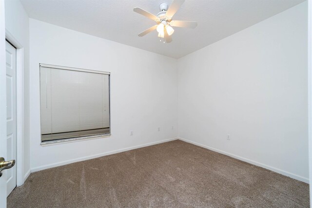 117 Laurel Wood Way Unit 105, Saint Augustine, FL 32086 - spare room featuring carpet floors, a ceiling fan, and baseboards
