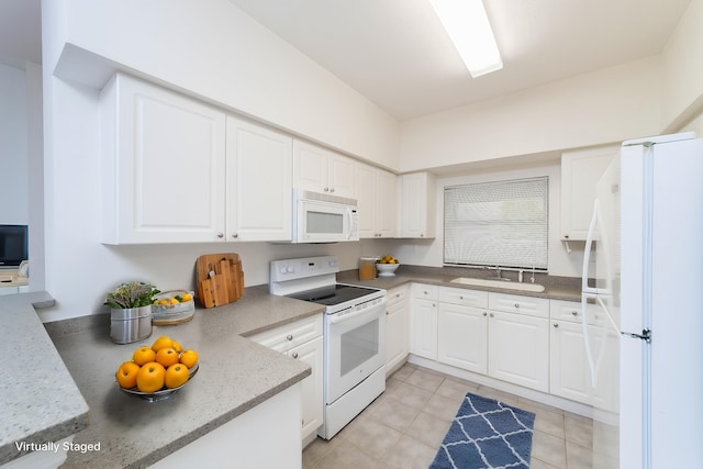 117 Laurel Wood Way Unit 105, Saint Augustine, FL 32086 - kitchen featuring white appliances, a sink, white cabinetry, and light tile patterned flooring