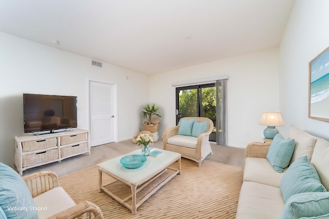 117 Laurel Wood Way Unit 105, Saint Augustine, FL 32086 - living area with carpet flooring and baseboards