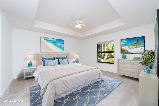 117 Laurel Wood Way Unit 105, Saint Augustine, FL 32086 - bedroom with a raised ceiling, light colored carpet, baseboards, and a ceiling fan
