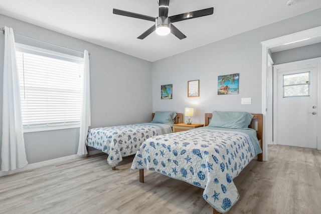 bedroom with ceiling fan and light hardwood / wood-style flooring