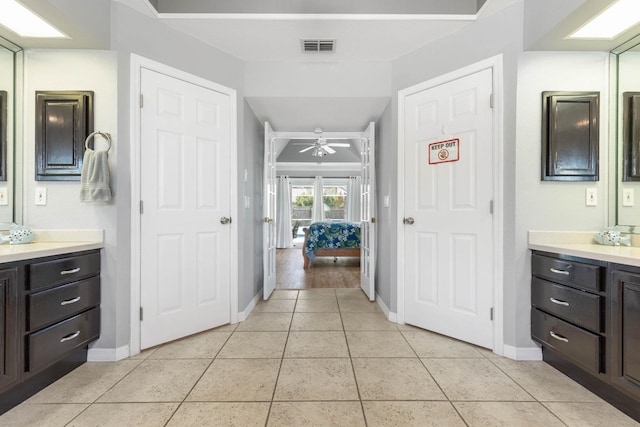 bathroom featuring ceiling fan, tile patterned flooring, and vanity