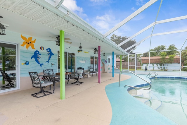 view of pool with a patio and glass enclosure