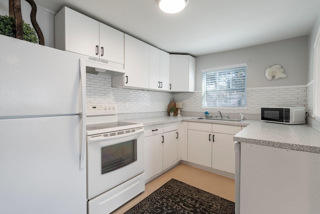 kitchen with white cabinetry, sink, white appliances, and decorative backsplash