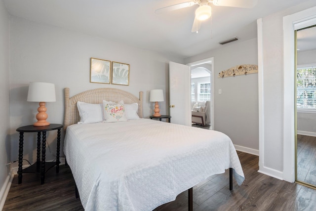 bedroom with dark wood-type flooring and ceiling fan