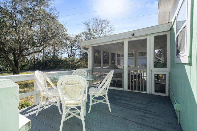 wooden terrace with a sunroom