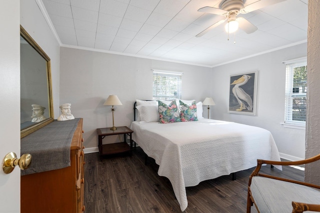 bedroom featuring crown molding, dark hardwood / wood-style floors, and ceiling fan