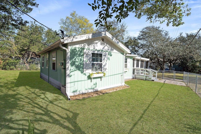 view of home's exterior with a yard