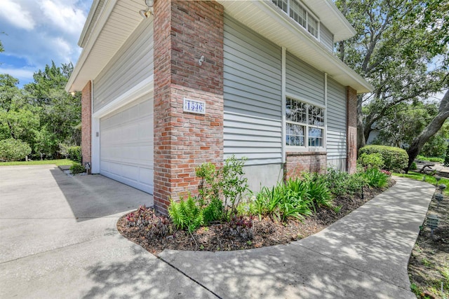 1536 San Rafael Way, Saint Augustine, FL 32080 - view of side of home featuring driveway and brick siding