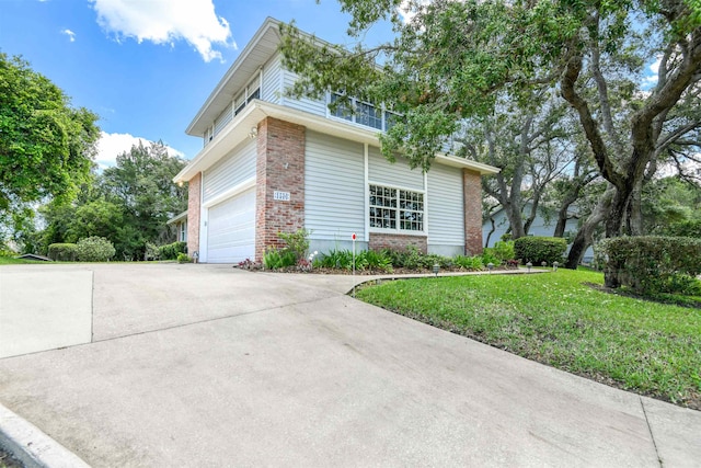 1536 San Rafael Way, Saint Augustine, FL 32080 - view of property exterior featuring brick siding, concrete driveway, a lawn, and an attached garage