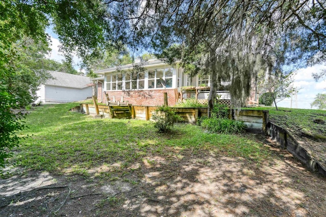1536 San Rafael Way, Saint Augustine, FL 32080 - back of house with brick siding, a sunroom, and a garage