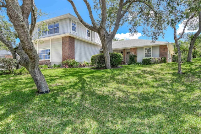 1536 San Rafael Way, Saint Augustine, FL 32080 - view of front facade with brick siding and a front lawn