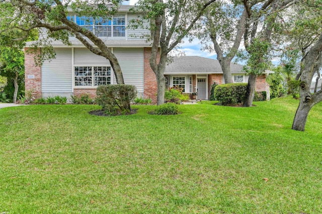 1536 San Rafael Way, Saint Augustine, FL 32080 - view of front facade featuring a front lawn and brick siding