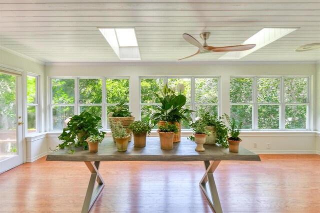 1536 San Rafael Way, Saint Augustine, FL 32080 - sunroom / solarium featuring a skylight, healthy amount of natural light, wood finished floors, and ornamental molding