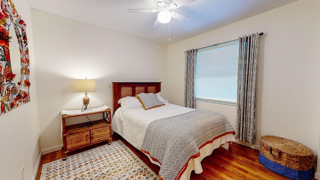 bedroom with hardwood / wood-style flooring and ceiling fan