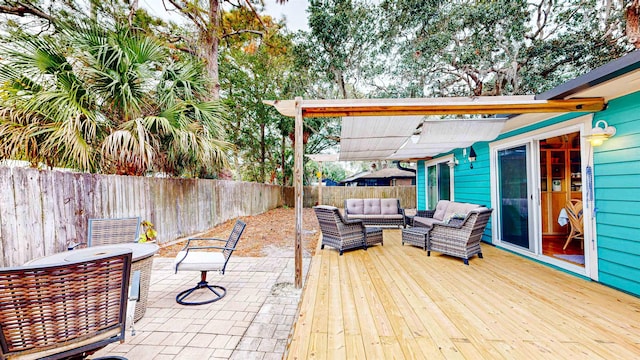 view of patio / terrace with a wooden deck and an outdoor living space