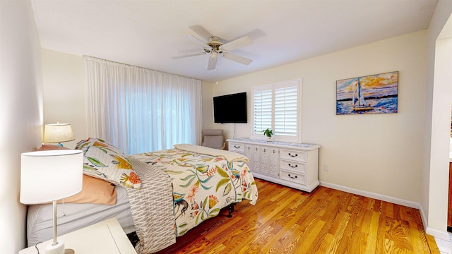 bedroom featuring ceiling fan and light wood-type flooring