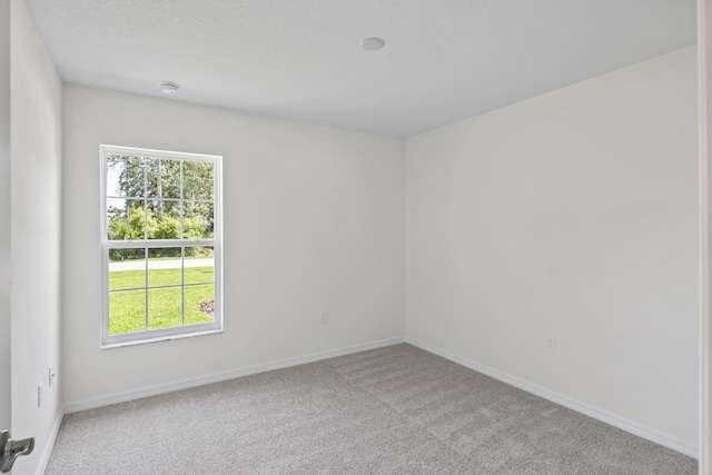 30 Palm Ln, Palm Coast, FL 32164 - carpeted empty room featuring baseboards