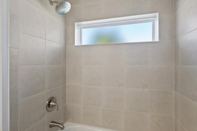 30 Palm Ln, Palm Coast, FL 32164 - full bathroom with washtub / shower combination and healthy amount of natural light