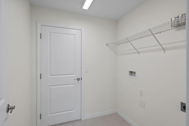 30 Palm Ln, Palm Coast, FL 32164 - laundry room featuring hookup for a washing machine, hookup for an electric dryer, and baseboards
