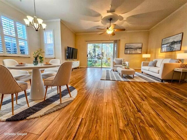 130 Bayberry Cir Unit 1501, Saint Augustine, FL 32086 - dining area featuring wood finished floors, a chandelier, crown molding, and plenty of natural light