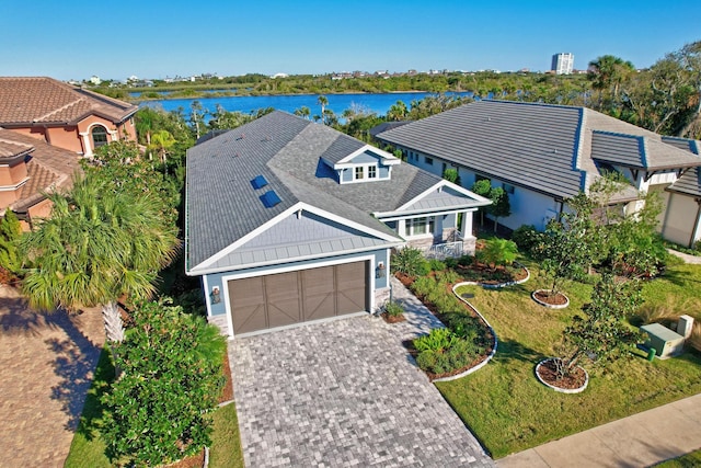 birds eye view of property with a water view