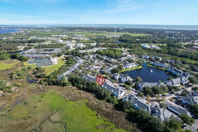 birds eye view of property featuring a water view
