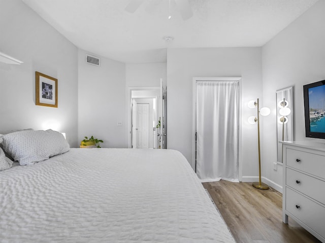 bedroom featuring ceiling fan and light wood-type flooring