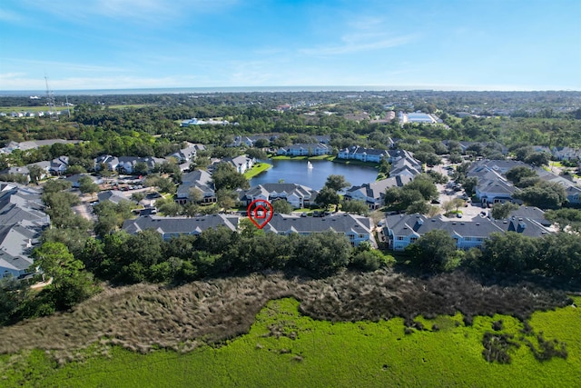 drone / aerial view with a water view and a residential view
