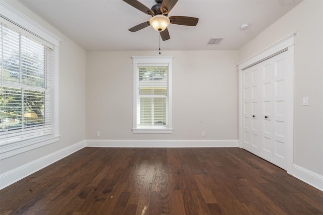 44 Carrera St, Saint Augustine, FL 32084 - unfurnished bedroom with dark wood finished floors, baseboards, and a closet