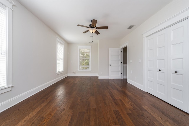 44 Carrera St, Saint Augustine, FL 32084 - unfurnished bedroom with dark wood finished floors, baseboards, and ceiling fan