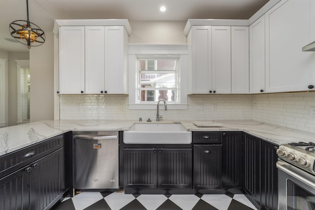 44 Carrera St, Saint Augustine, FL 32084 - kitchen with a sink, stainless steel appliances, white cabinetry, tasteful backsplash, and recessed lighting