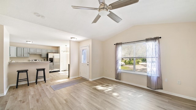 3416 6th St, Elkton, FL 32033 - unfurnished living room featuring light wood finished floors, lofted ceiling, and a ceiling fan