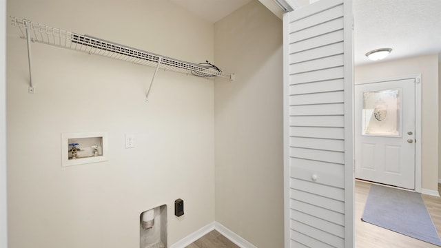 3416 6th St, Elkton, FL 32033 - laundry room with hookup for a washing machine, light wood-type flooring, and hookup for an electric dryer