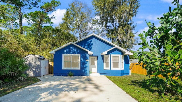 3416 6th St, Elkton, FL 32033 - bungalow-style house with a shed and stucco siding