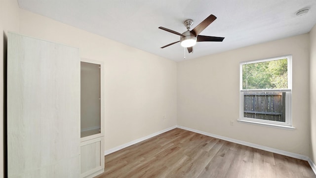 3416 6th St, Elkton, FL 32033 - empty room featuring light wood-type flooring, a smoke detector, and ceiling fan