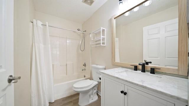 3416 6th St, Elkton, FL 32033 - bathroom with vanity, wood finished floors, and shower / bath combo with shower curtain