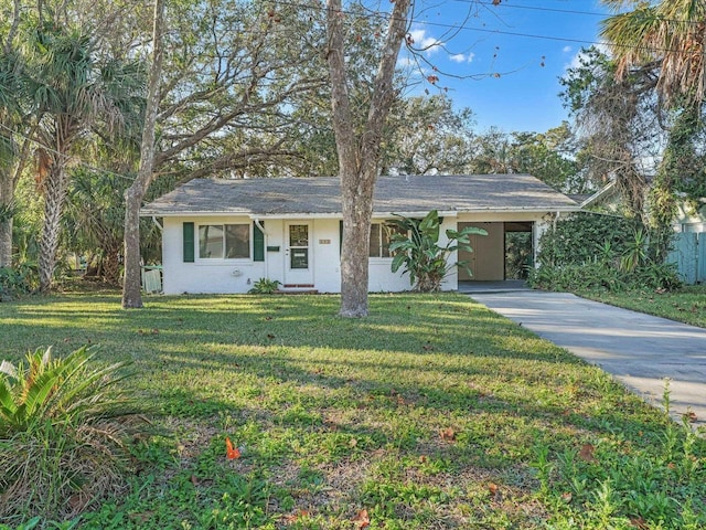 ranch-style house with a front yard and a carport