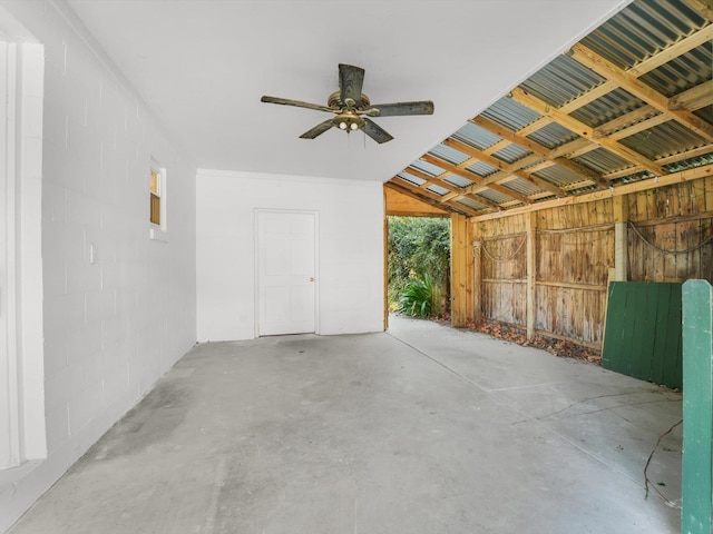 interior space with ceiling fan