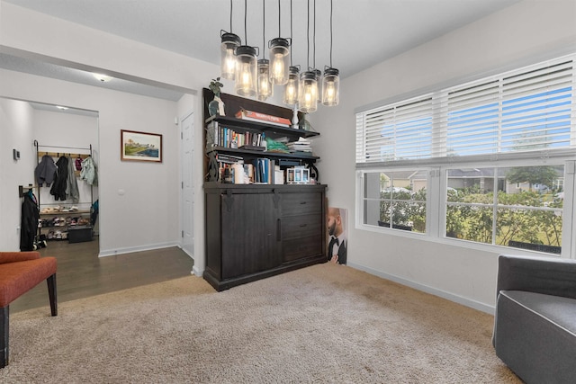 121 Sawmill Forest Ct, Saint Augustine, FL 32086 - sitting room featuring an inviting chandelier, baseboards, and carpet floors